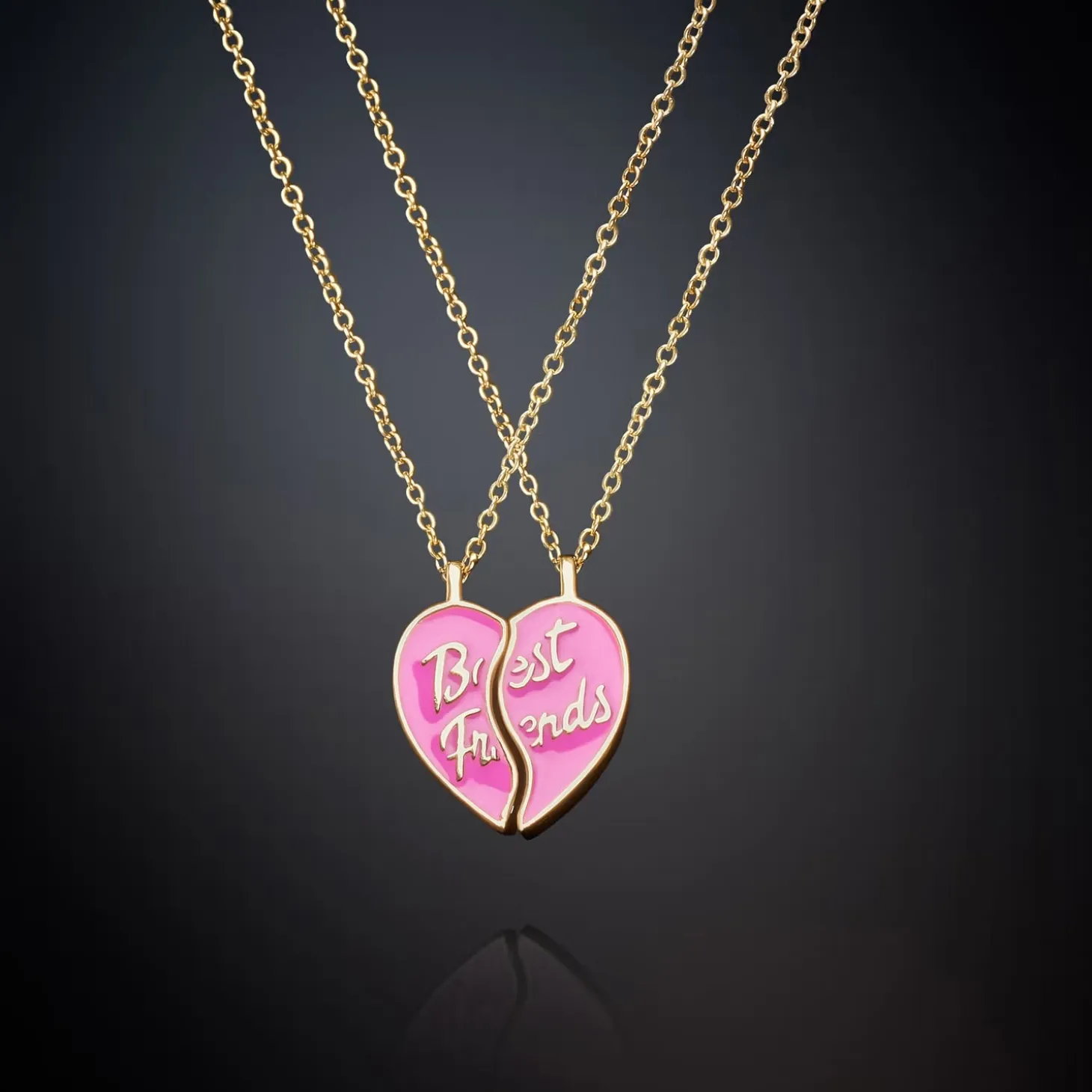 PAIR OF NECKLACES WITH PINK HALF HEART PENDANTS
